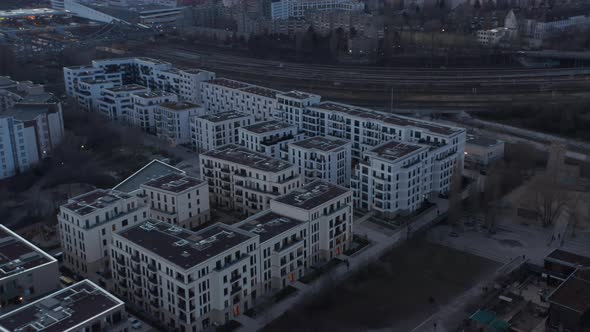 Aerial Circular Motion View of Empty Rooftop of Residential Houses Besides Railway Line with People