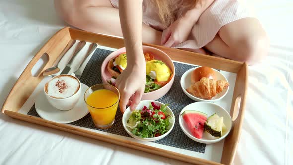 Breakfast in Bed Tray with Cup of Coffee Croissants Eggs and Orange Juice