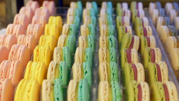 Close Up Colorful Macarons Dessert in Bakery Shop at Store Glass Case