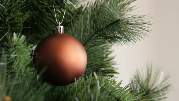 Luxurious matte Christmas tree bauble shallow DOF decoration 4K 2160p 30fps UltraHD footage - Bronze