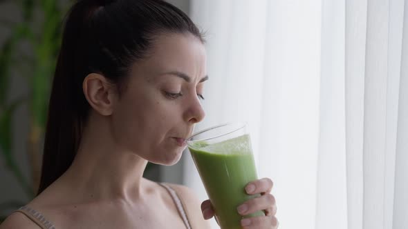 Closeup Portrait Young Satisfied Beautiful Woman Drinking Tasty Detox Smoothie Indoors Looking Out