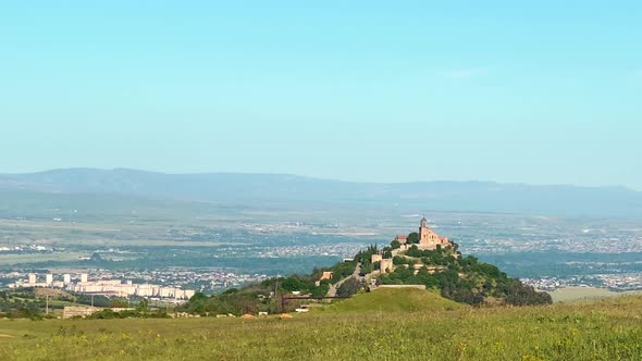 Panoramic View With Monastery Over Hill