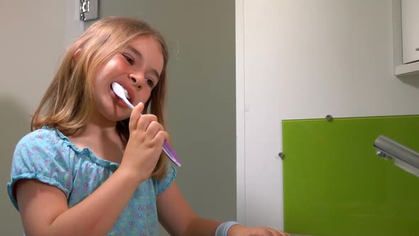 Girl Cleans His Teeth