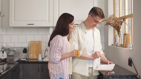 Positive Loving Couple Planning Their Income, Budget