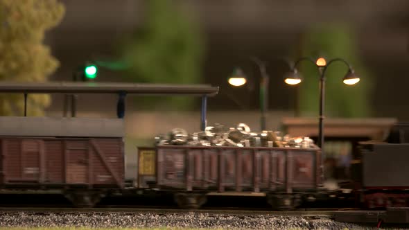 Miniature Steam Train Driving Through Station.