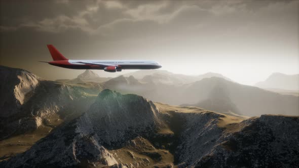 Passenger Aircraft Over Mountain Landscape