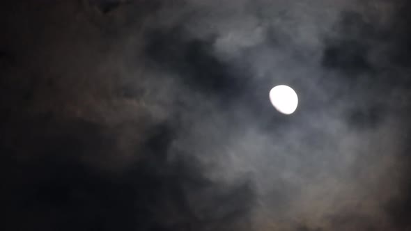 Full Moon Timelapse with Clouds in the Dark Sky