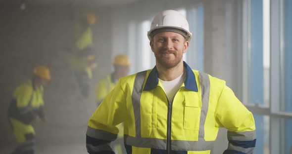 Portrait of Home Repair Worker in Uniform Smiling at Camera