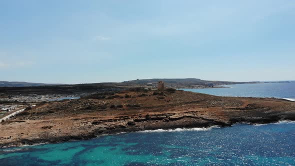 Aerial view of Coral Beach towards White Tower in Mellieha Armier Bay, Malta