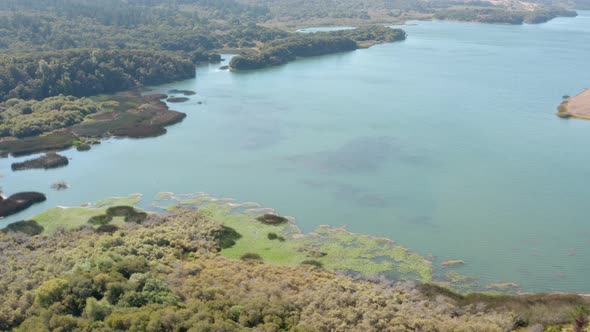 Aerial: Half Moon Bay Lake and Landscape. Panning Right