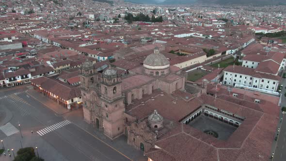 4k daytime aerial drone footage with the Church of the Society of Jesus from Plaza de Armas in Cusco