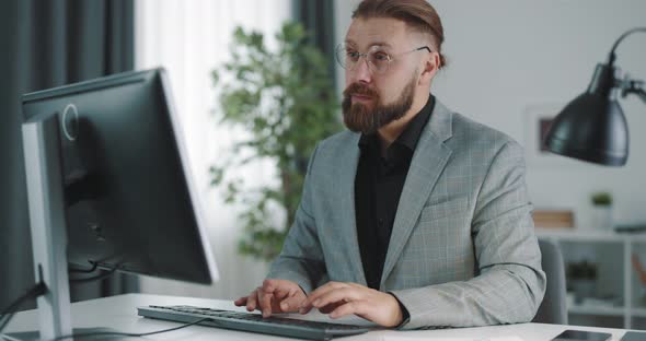 Man Using Pc at Office