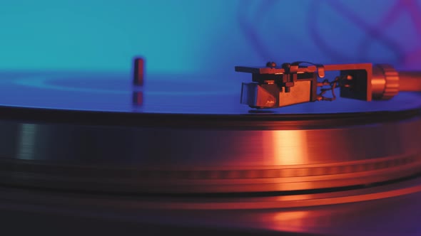 A Vinyl Record Spins in the Gramophone Music Player and Plays an Old Disco