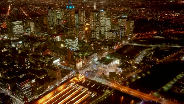 Night timelapse of busy downtown Melbourne city filled with movements of pedestrians, traffics  and