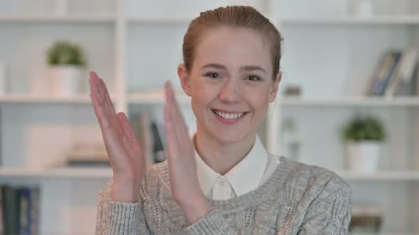 Portrait of Appreciative Young Woman Clapping