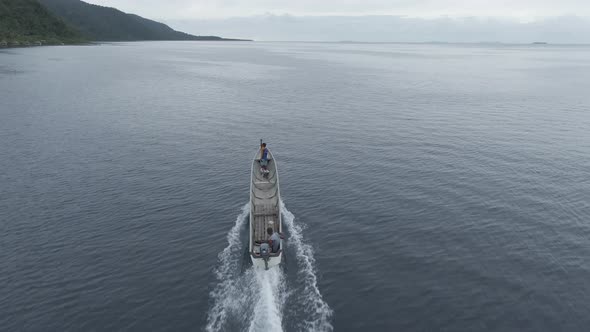 Aerial View Of Boat Splashing Water In Triton Bay In Kaimana Islands. 