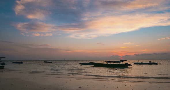 Time lapse: sunset over tropical beach and sea colorful dramatic sky moving clou