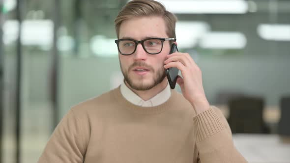 Young Creative Man Talking on Phone