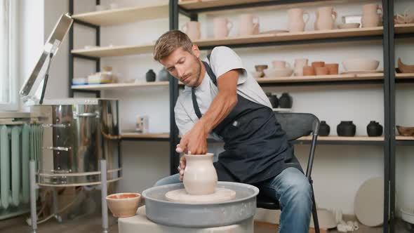 Handicraft the Man Potter Makes a Pitcher Out of Clay Handicraft Production of Handmade Tableware