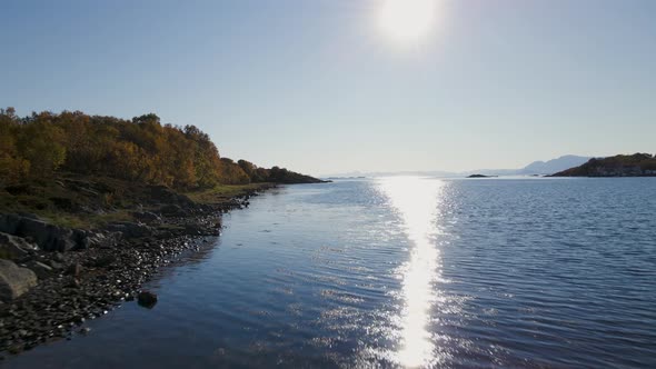 Glistening Water With Sunlight Reflection On Senja Island In Norway. Aerial Drone