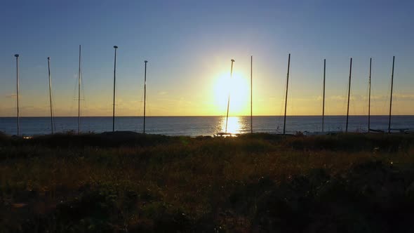 An awesome flying shot approaching the beach during sunrise.