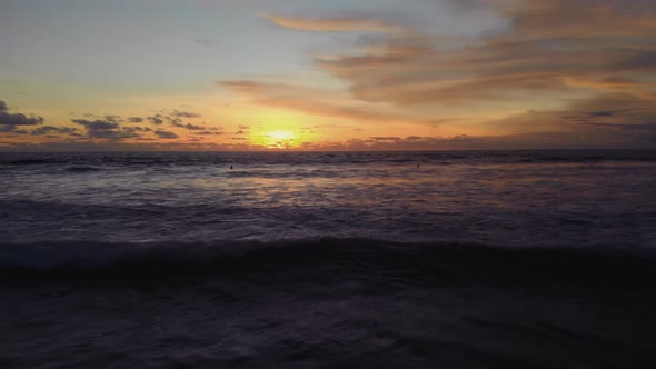 Flight at Sunset Overlooking the Indian Ocean in Bali Indonesia