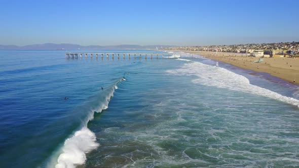 Aerial drone uav view of a pier over the beach and ocean.