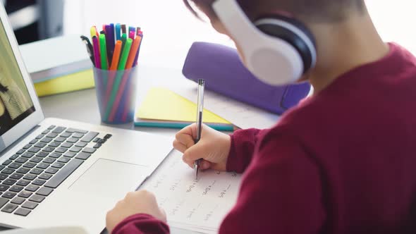 Video of boy doing  math equation during  homeschooling. Shot with RED helium camera in 8K.