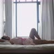 Young Pretty Woman in Dress Falling Down on Bed Relaxes at Careless Weekend Time on the Panoramic - VideoHive Item for Sale