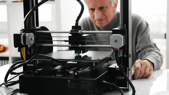 Adult Man with 3D Printer
