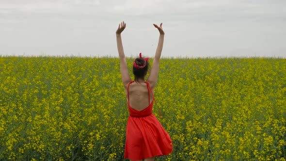 Young Sexy Woman in Red Dress Dancing