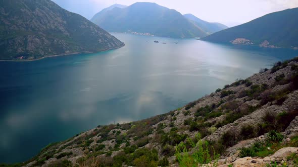 Top View on Sea Surrounded Mountains Overcast Sky