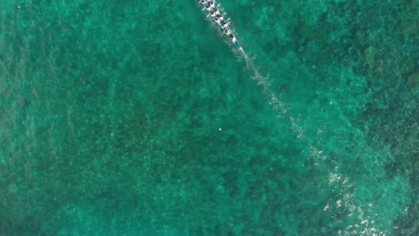 Aerial: top down kora-kora traditional canoe annual race in Indonesia