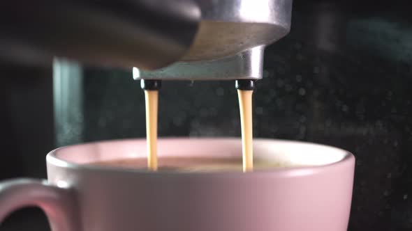Footage B Roll of Pouring coffee stream from machine in cup. Home making hot Espresso.