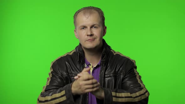 Happy Rocker Man in Brown Denim Jacket Clapping Hands and Looking with Proud Facial Expression