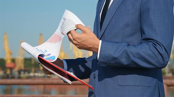 Trader Man Checks Financial Reports