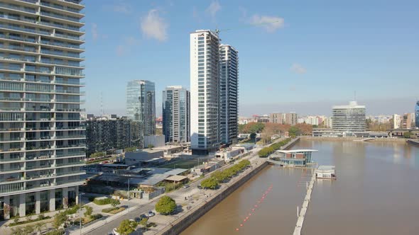 Aerial establishing shot of Puerto Madero neighborhood with some buildings at daytime