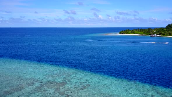 Sunny scenery of tropical tourist beach break by blue lagoon and sand background near resort