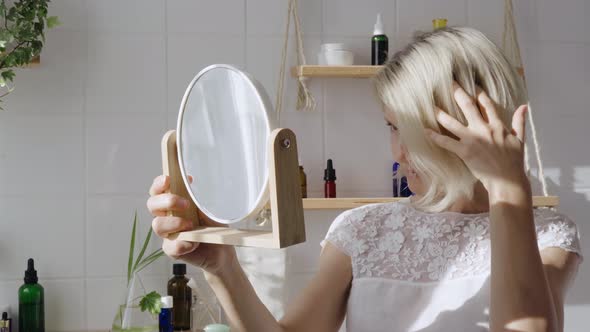 Middleaged Woman Looking in the Mirror