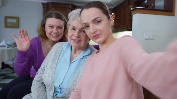 Selfie Camera POV of Cheerful Multigenerational Women Taking Selfie at Home Indoors