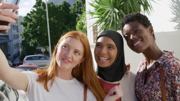 Young adult female friends hanging out together