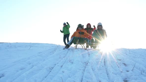 Two Senior Men Tobogganing in Slow Motion