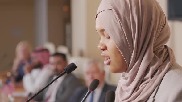 Muslim Woman Making Speech at Political Press Conference