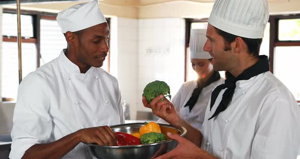 Head chef and his team inspecting the vegetables