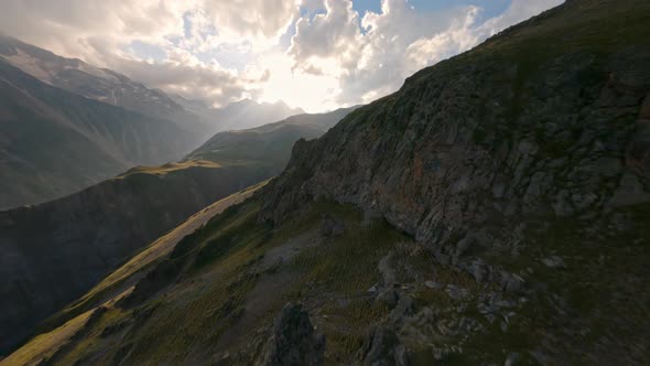 Aerial View Flight Over Cliff Ridge Texture Hilly Terrain Covered By Green Grass