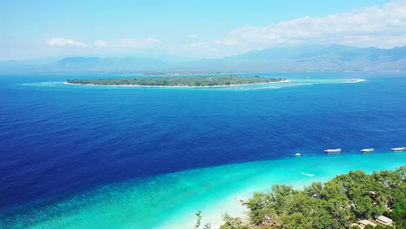 Daytime above copy space shot of a white sandy paradise beach and turquoise sea background in high r