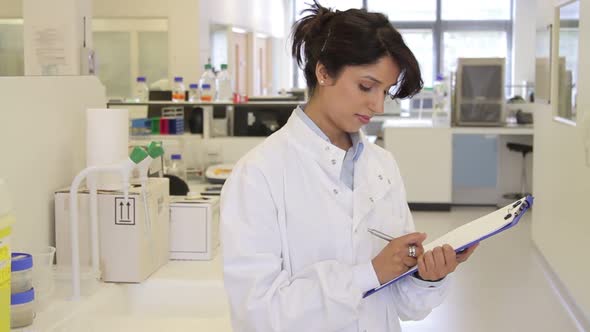 Portrait of female scientist in laboratory