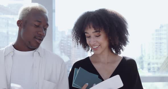 Young Attractive African Guy and Ethnic Curly Cute Girl Standing, Talking Actively, Laughing