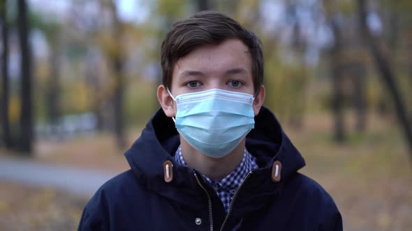 Boy in Medical Mask on the Street