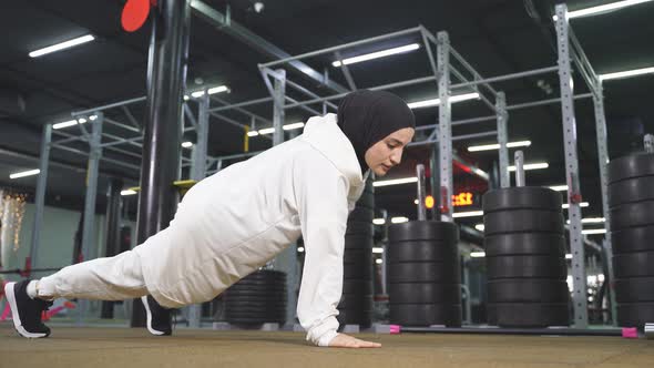 Portrait of a Muslim Woman During a Sports Workout in a Modern Fitness Room